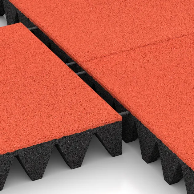 Le gros plan sur le système de connexion des revêtements de sol WARCO 5639 - Dalle amortissante 10 cm - EN 1177 ≤ 300 cm en couleur Rouge-Orange Clair. Les dimensions 500 x 500 x 100 mm.