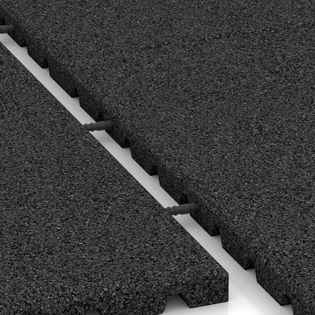 Le gros plan sur le système de connexion des revêtements de sol WARCO 0756 - Dalle anti-choc en couleur Anthracite. Les dimensions 1000 x 1000 x 30 mm.