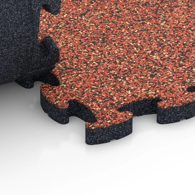 Le gros plan sur le système de connexion des revêtements de sol WARCO 6935 - Dalle amortissante puzzle en couleur Etna. Les dimensions 44,6 x 44,6 × 2,8 cm.