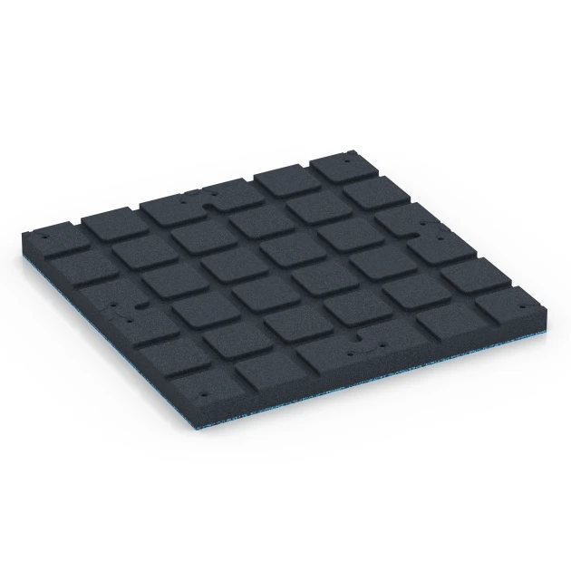 La vue du dessous ou de la face inférieure, c’est-à-dire la face inférieure de la pièce moulée WARCO 7148 - Revêtement sportif extérieur au format 60 x 60 x 4 cm | 0,36 m².